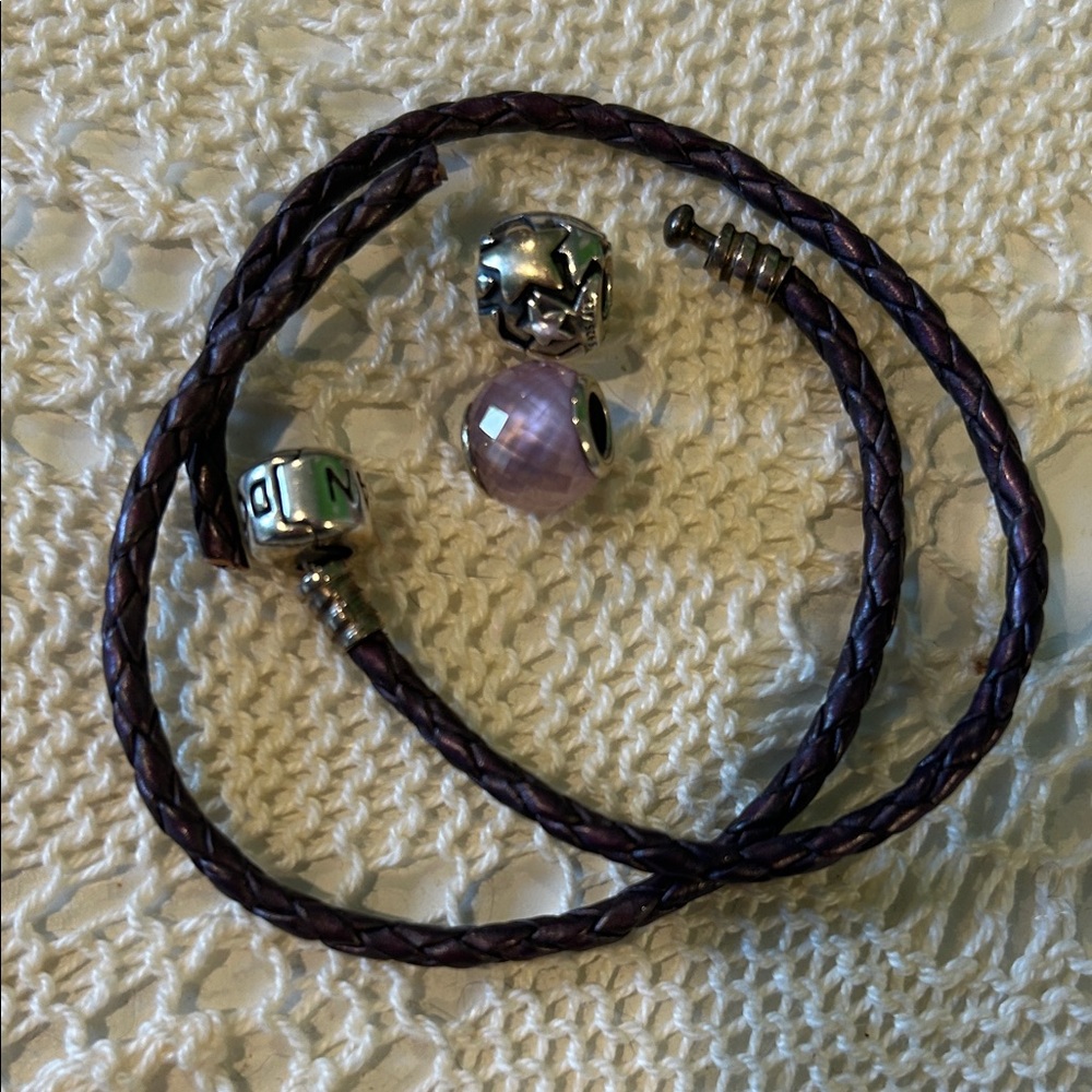 Pandora purple bracelet, broken but comes w 2 charms also Pandora